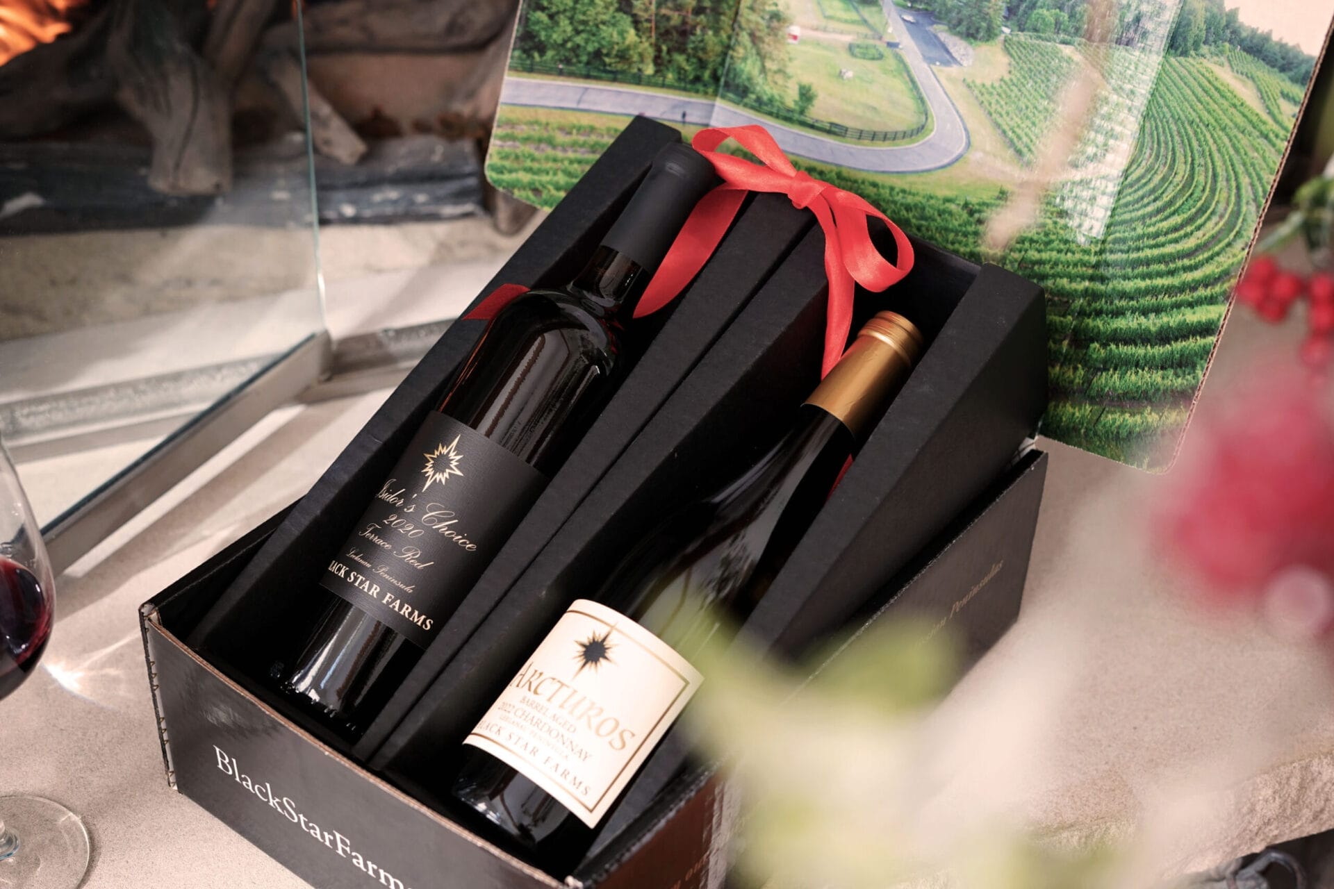  Purple beverage with cherry garnish against American flag backdrop.