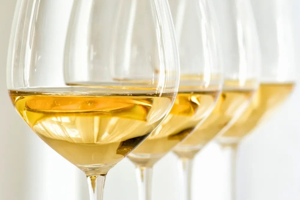 Four glasses of white wine
